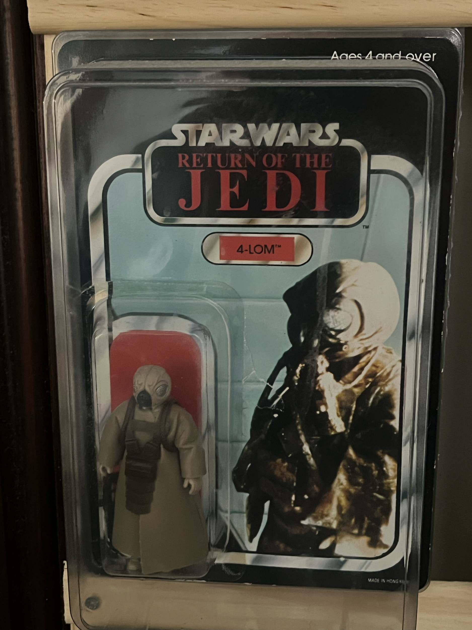 Vintage metal lunchbox featuring Star Wars Return of the Jedi characters, including a soldier with a helmet and mask, and a man dressed in a camouflage uniform with a helmet, holding a weapon.