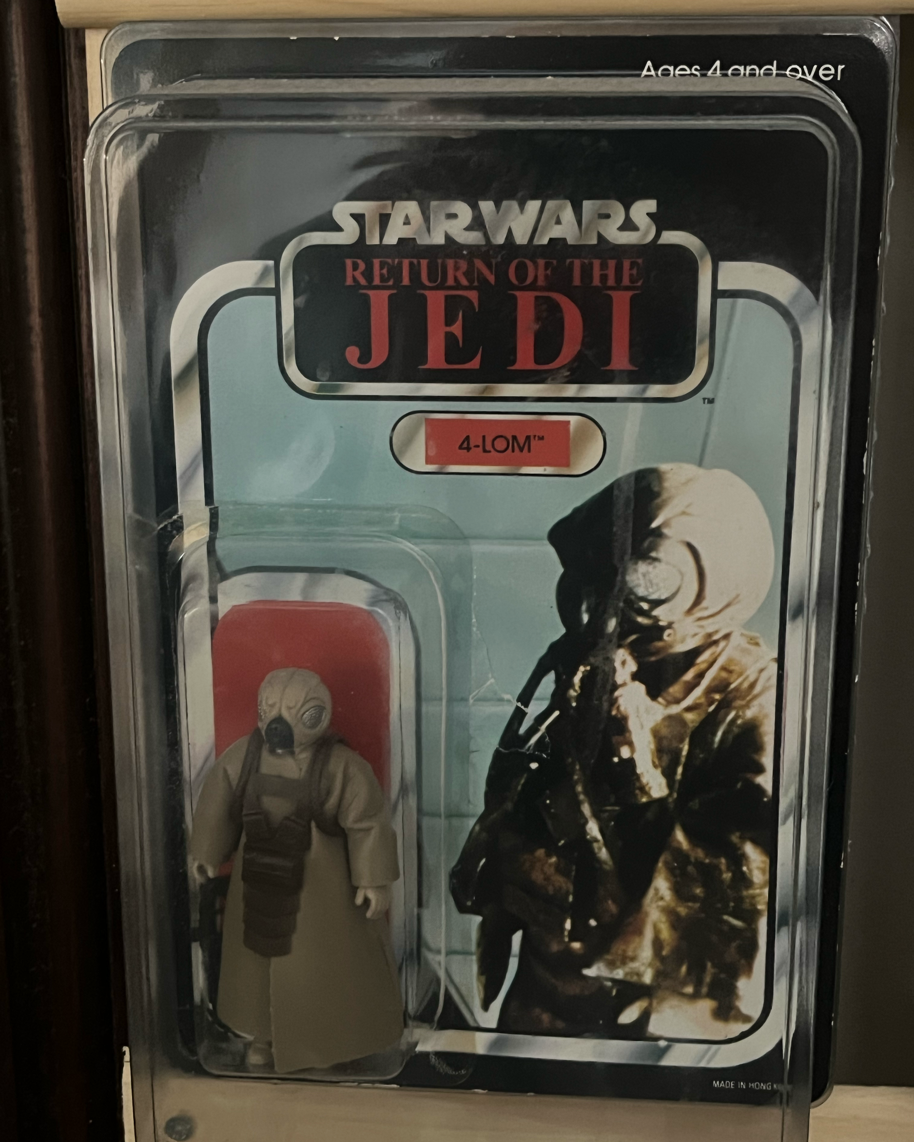 Vintage metal lunchbox featuring Star Wars Return of the Jedi characters, including a soldier with a helmet and mask, and a man dressed in a camouflage uniform with a helmet, holding a weapon.