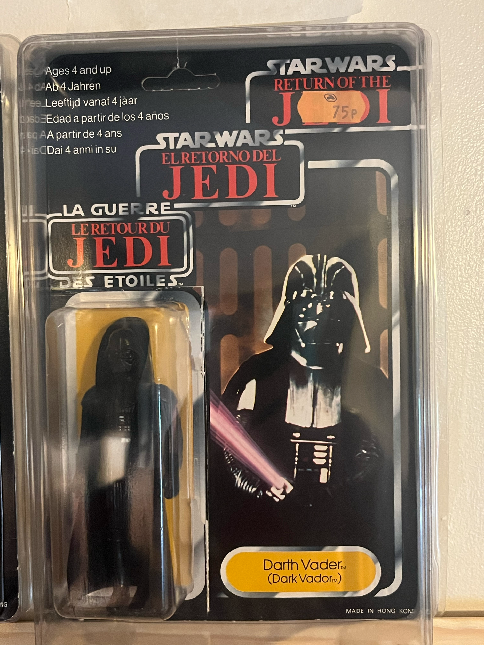 Star Wars action figure set in clear plastic packaging, featuring Darth Vader in black armor and helmet, with the label indicating 'Darth Vader (Dark Vador)' and the price of 75 pesos.