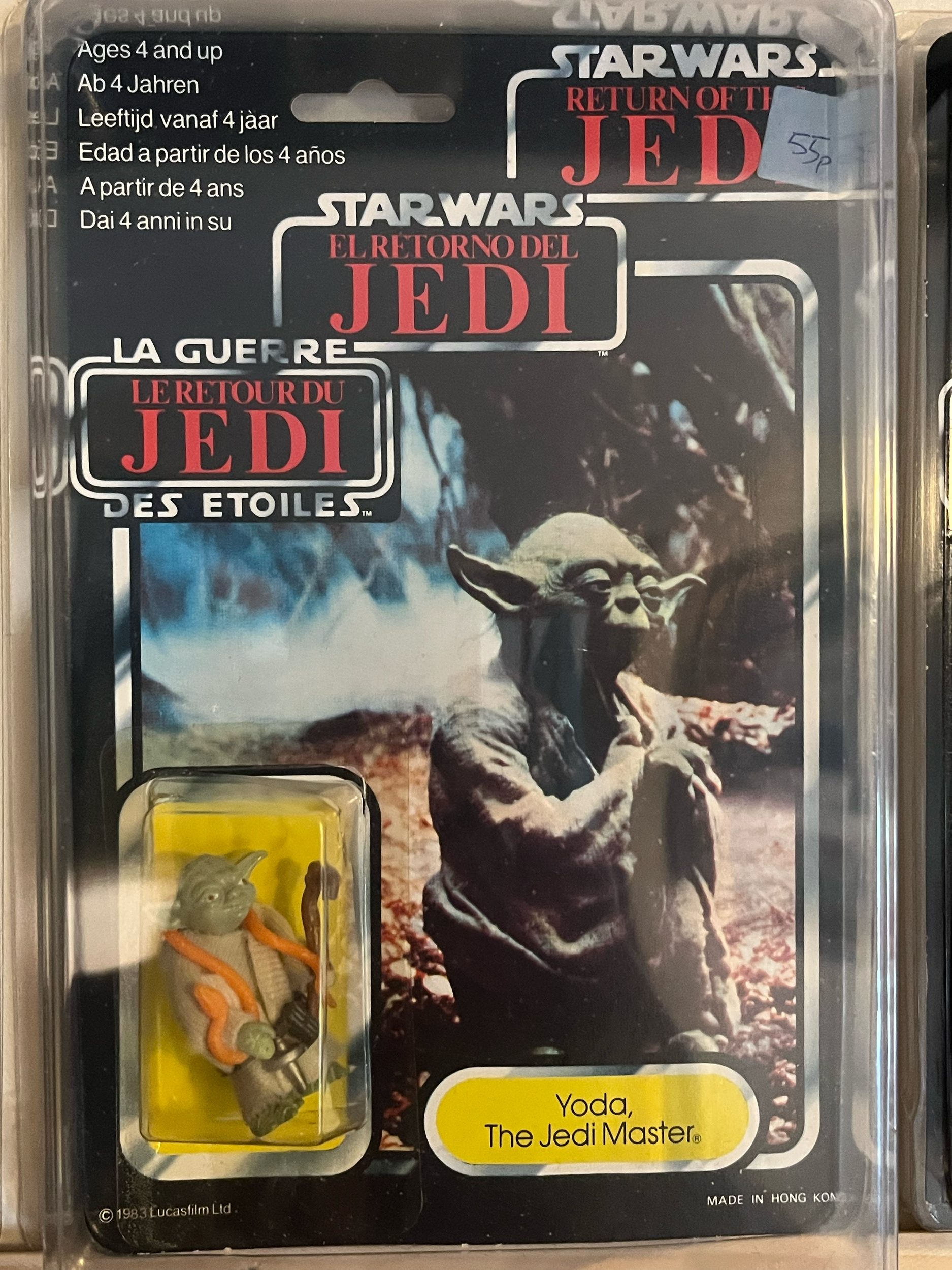 Close-up of a toy action figure resembling a rat or rodent, with accessories including a miniature snake and snake-like toy, inside clear plastic packaging.
