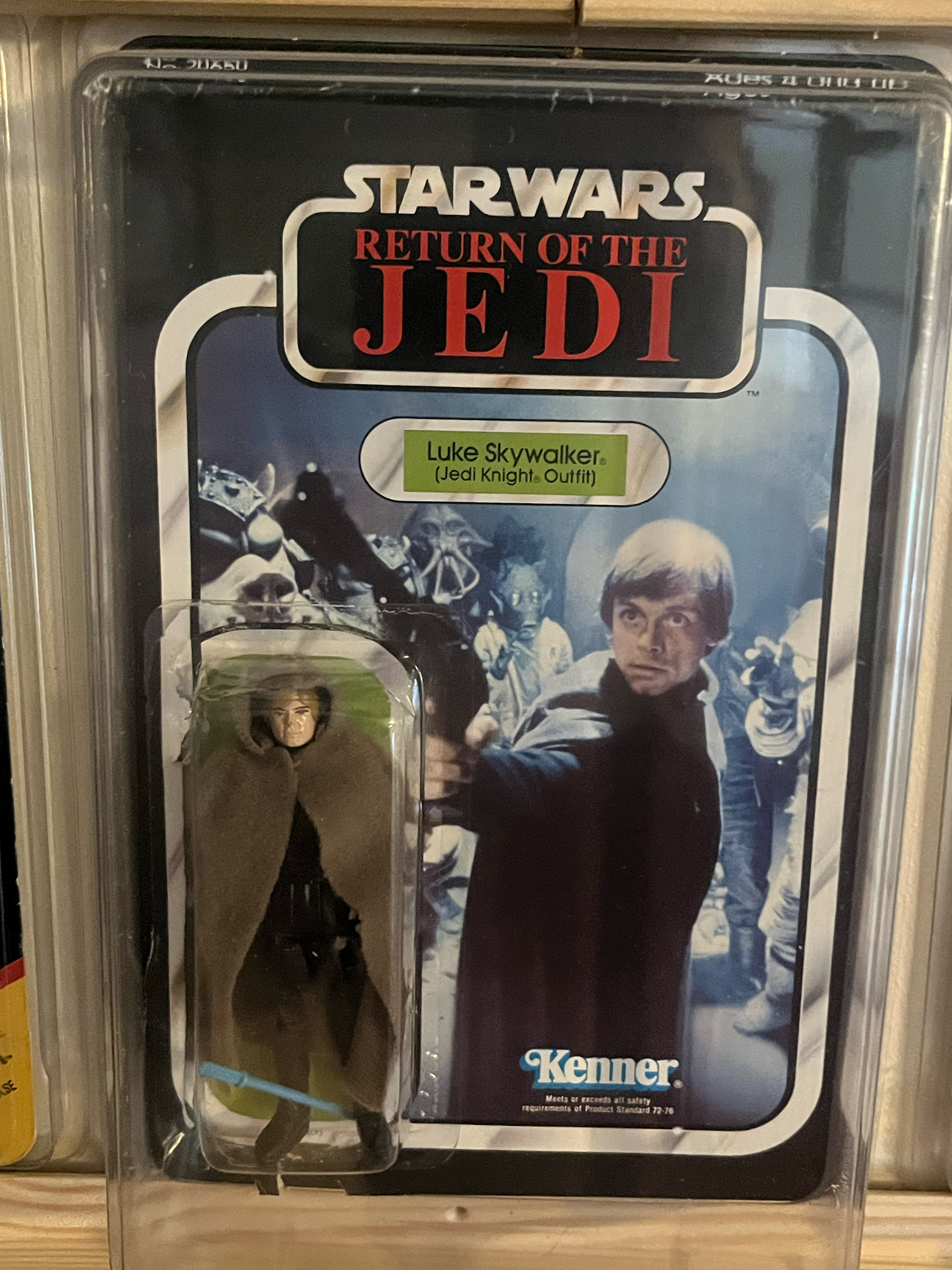 A framed action figure of Luke Skywalker from Star Wars Episode V: The Empire Strikes Back in an acrylic display case