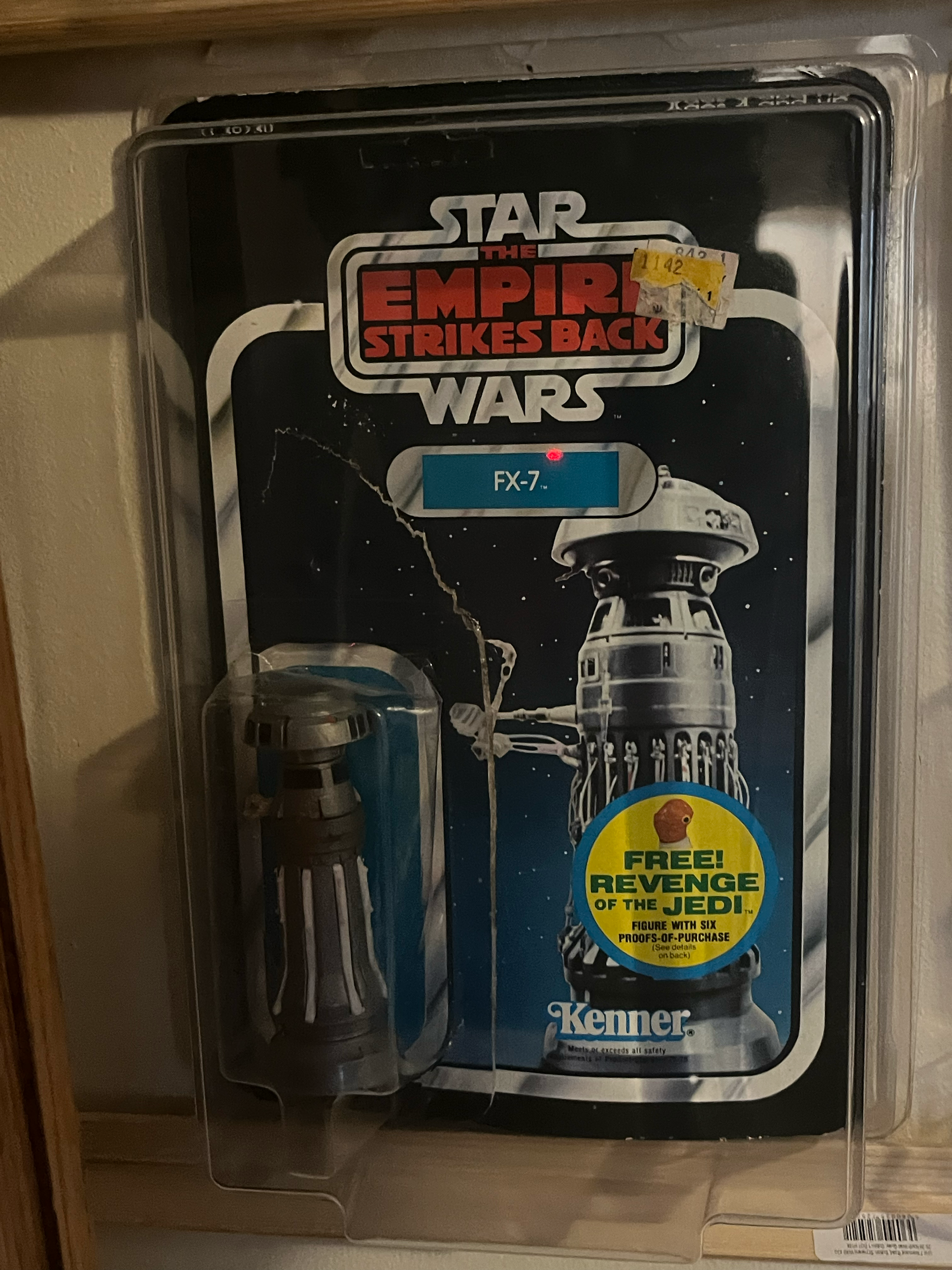 Star Wars the Empire Strikes Back collectible figure of fx7 in its original packaging with a space-themed background.