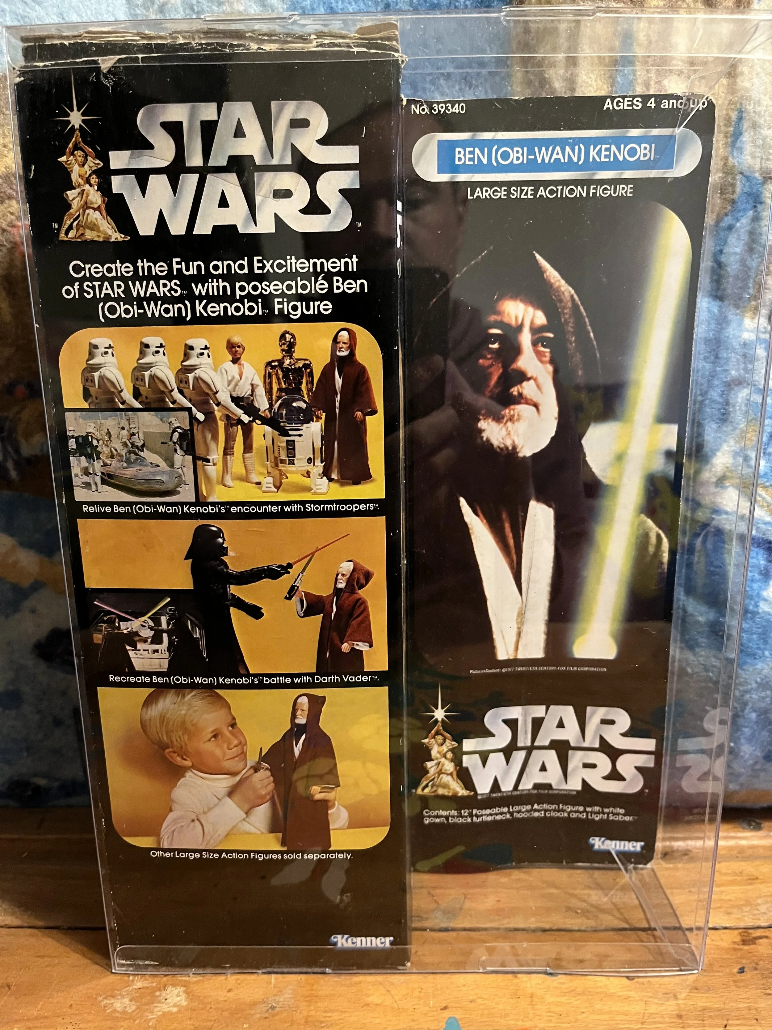 Star Wars action figure packaging featuring Obi-Wan Kenobi and Darth Vader with images of the characters and their faces on the packaging.