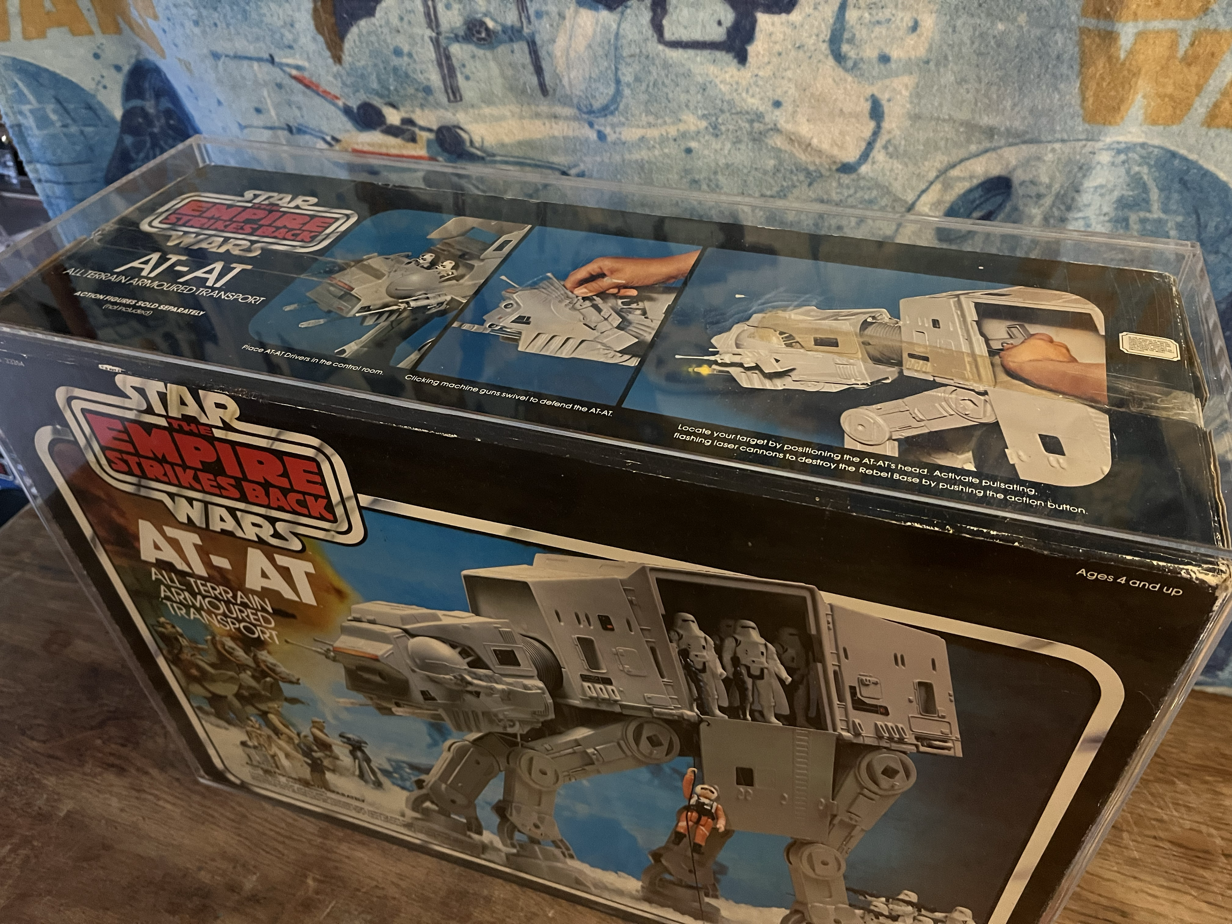 Star Wars vintage Empire Strikes Back AT-AT All Terrain Armored Transport toy in packaging, with instructions and accessories visible inside.