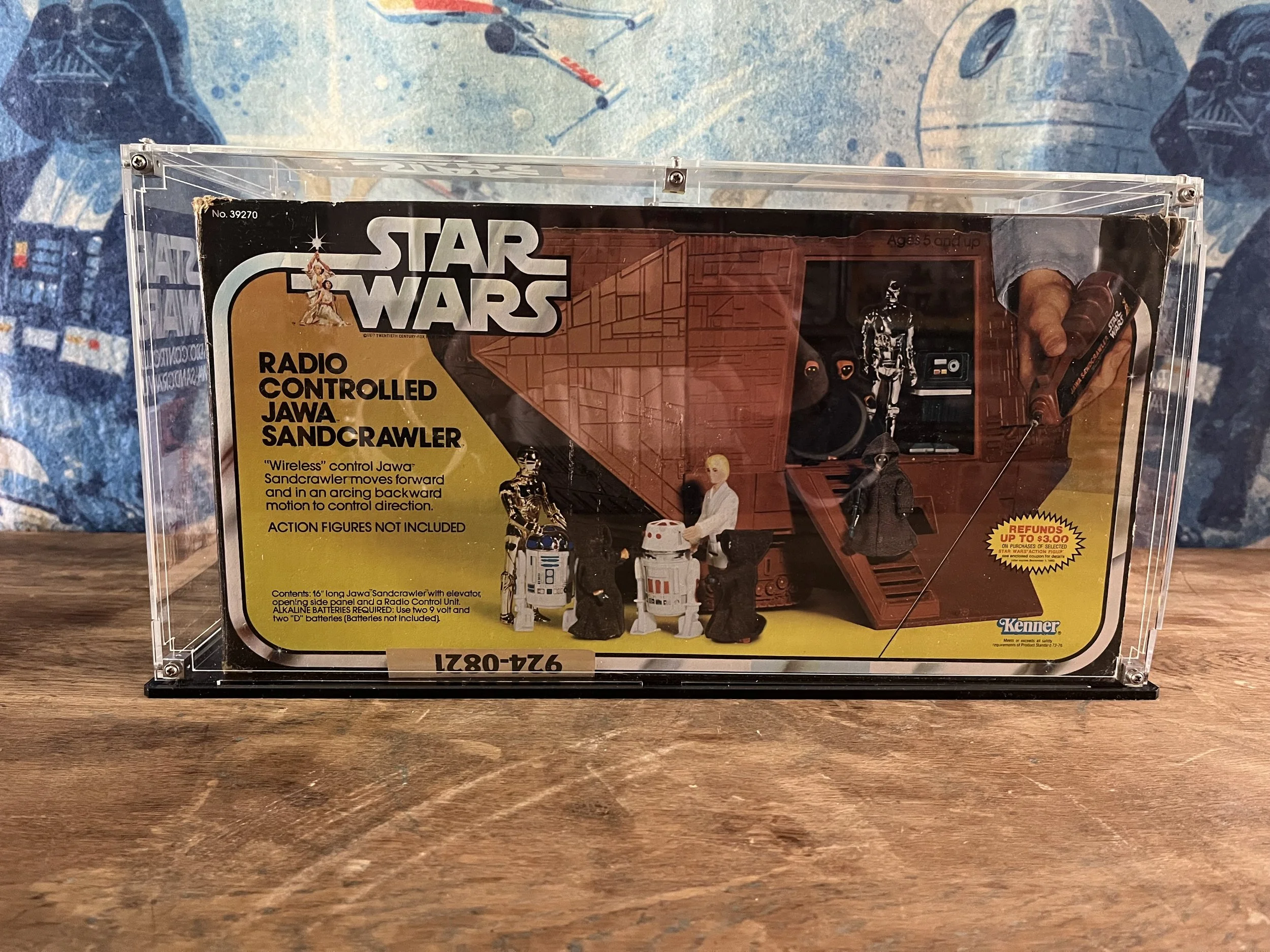 Star Wars vintage toy packaging for a radio-controlled Jawa Sandcrawler toy, featuring images of the toy, action figures including Java and R2-D2, and the Star Wars logo on the front.