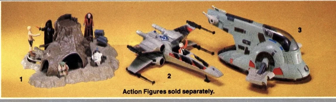 Three Star Wars toy vehicles and figures: a rocky mountain playset with three action figures around it, a gray spaceship with a pilot figure inside, and a large gray and black spacecraft with red accents.