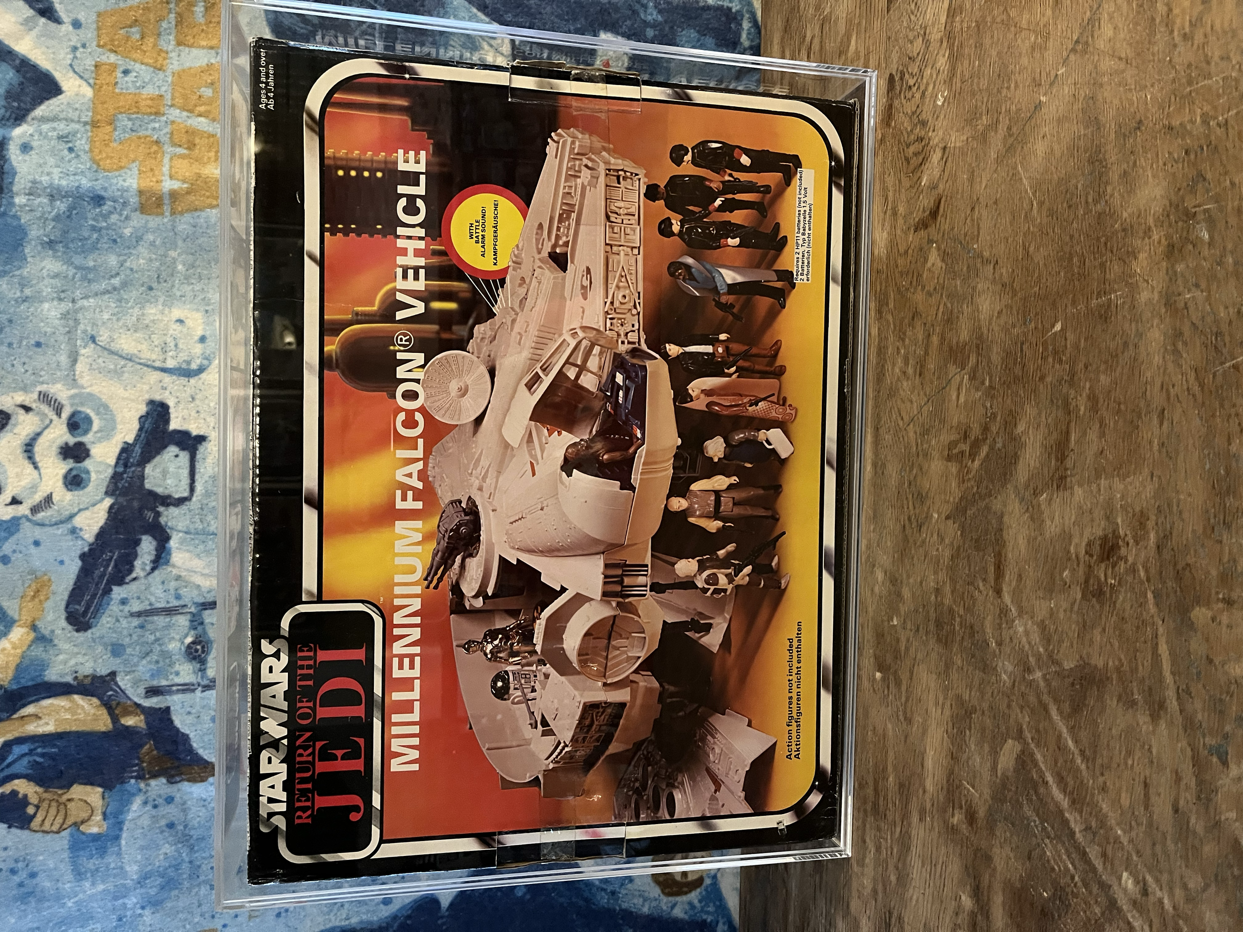 A vintage LEGO set box for the Imperial AT-AT Walker from Star Wars, featuring action figures of Imperial officers and scout troopers, with a backdrop of a starry sky and a battle scene.