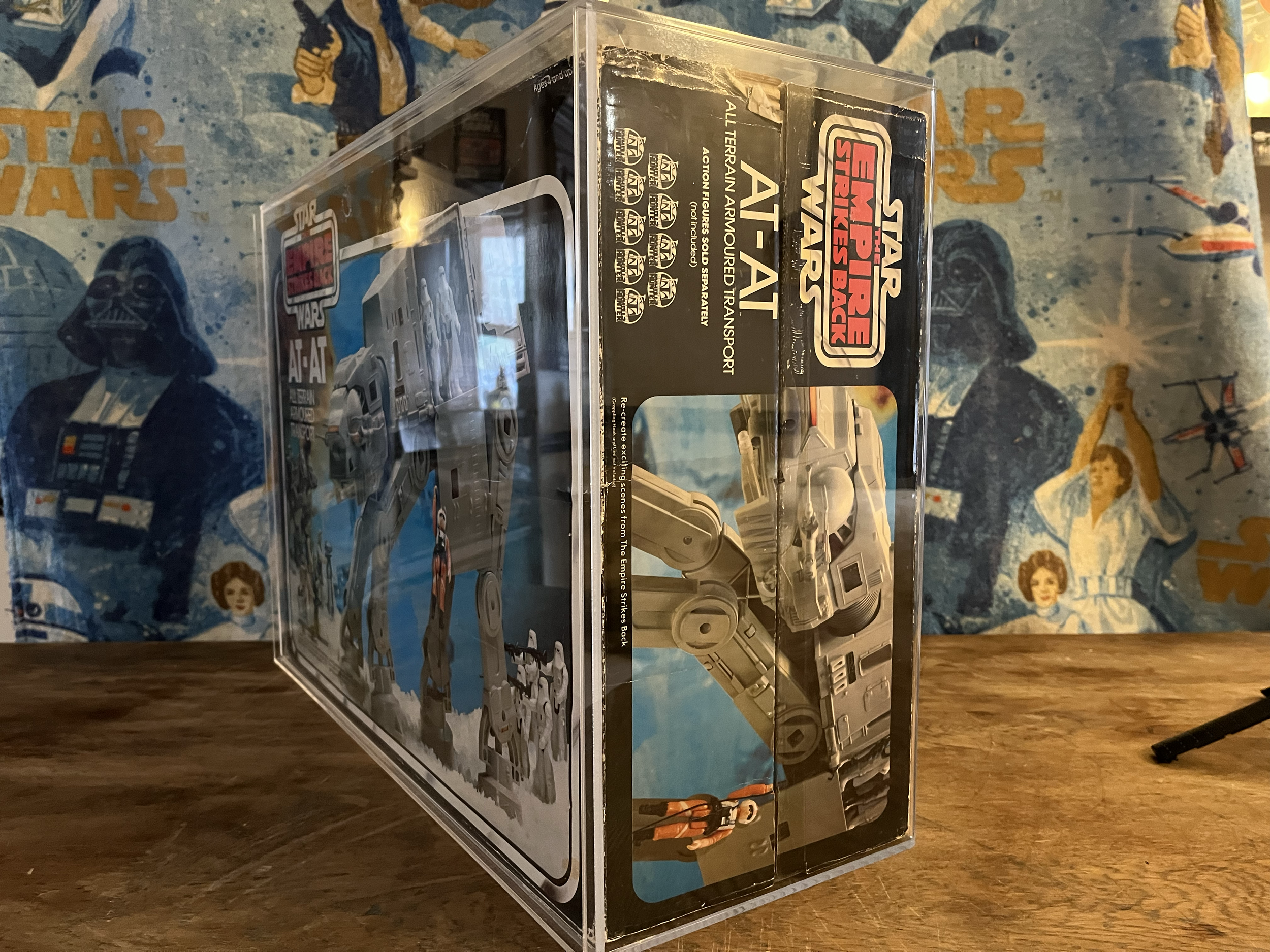 Close-up of a Star Wars Action Figures Back set, featuring various starships and characters from the Star Wars universe on a colorful background with star and character illustrations.