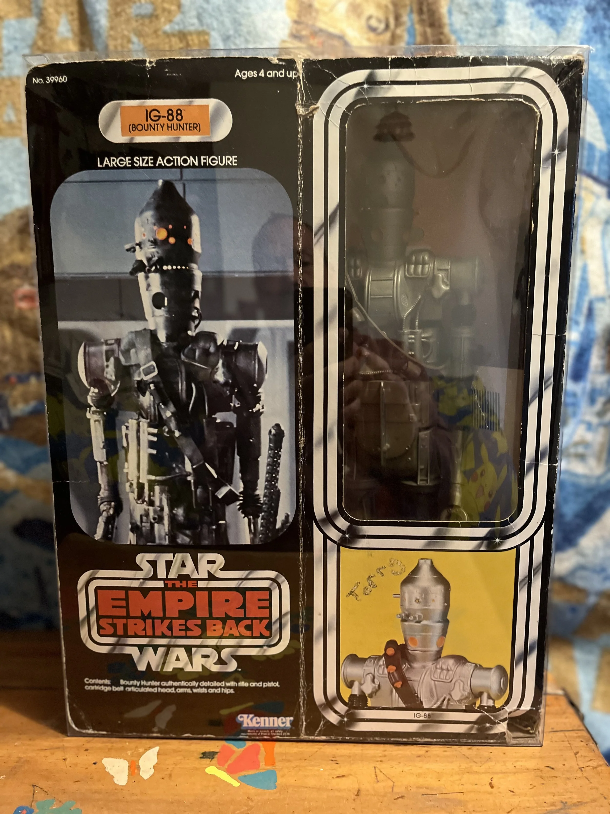 Vintage  Kenner Star Wars vintage action figure boxed 15 inch large size IG-88 character from The Empire Strikes Back with some visible damage and wear.