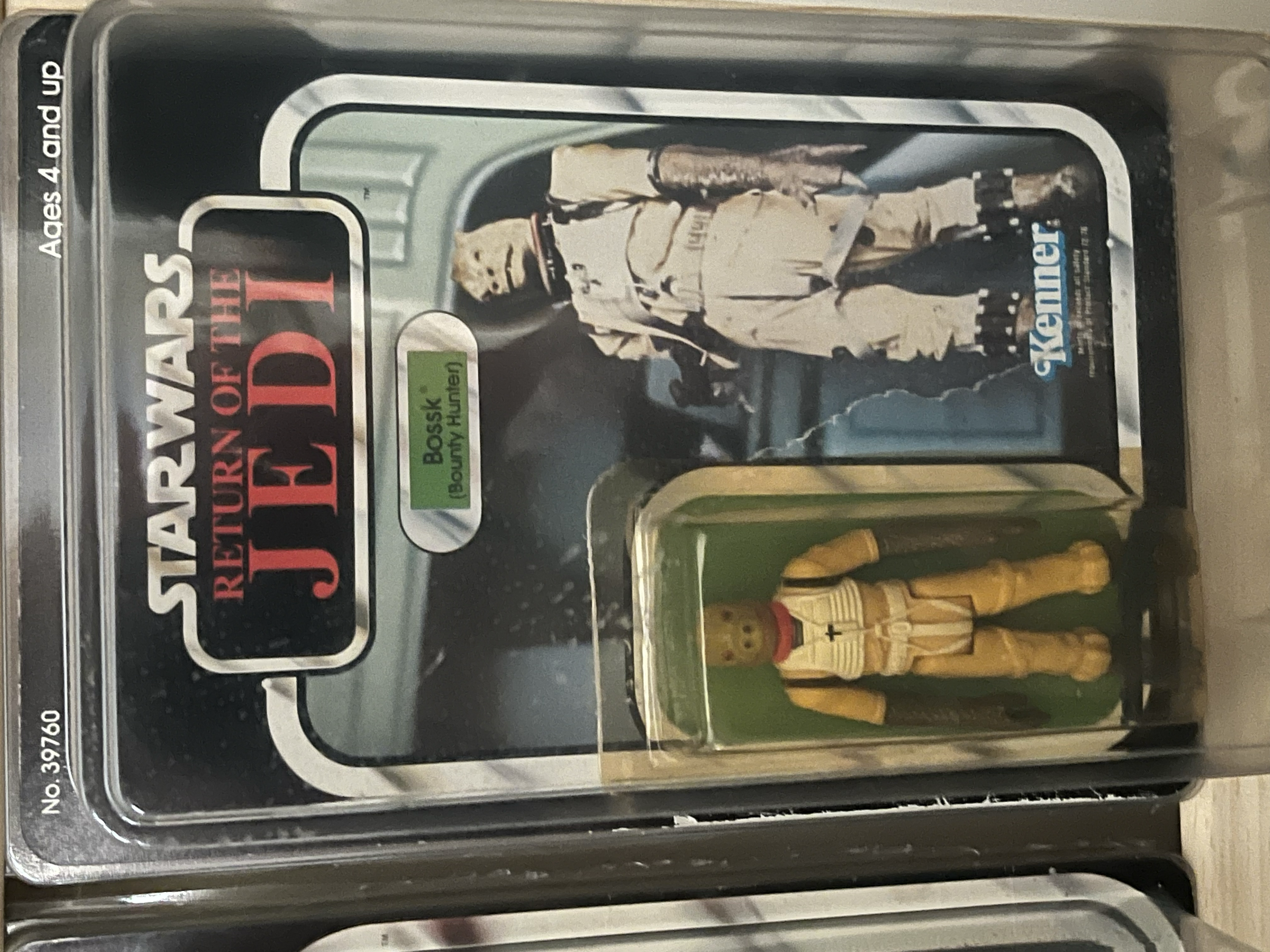 A vending machine displaying action figures, including a Freddy Krueger figure with a brown fedora hat and striped sweater.