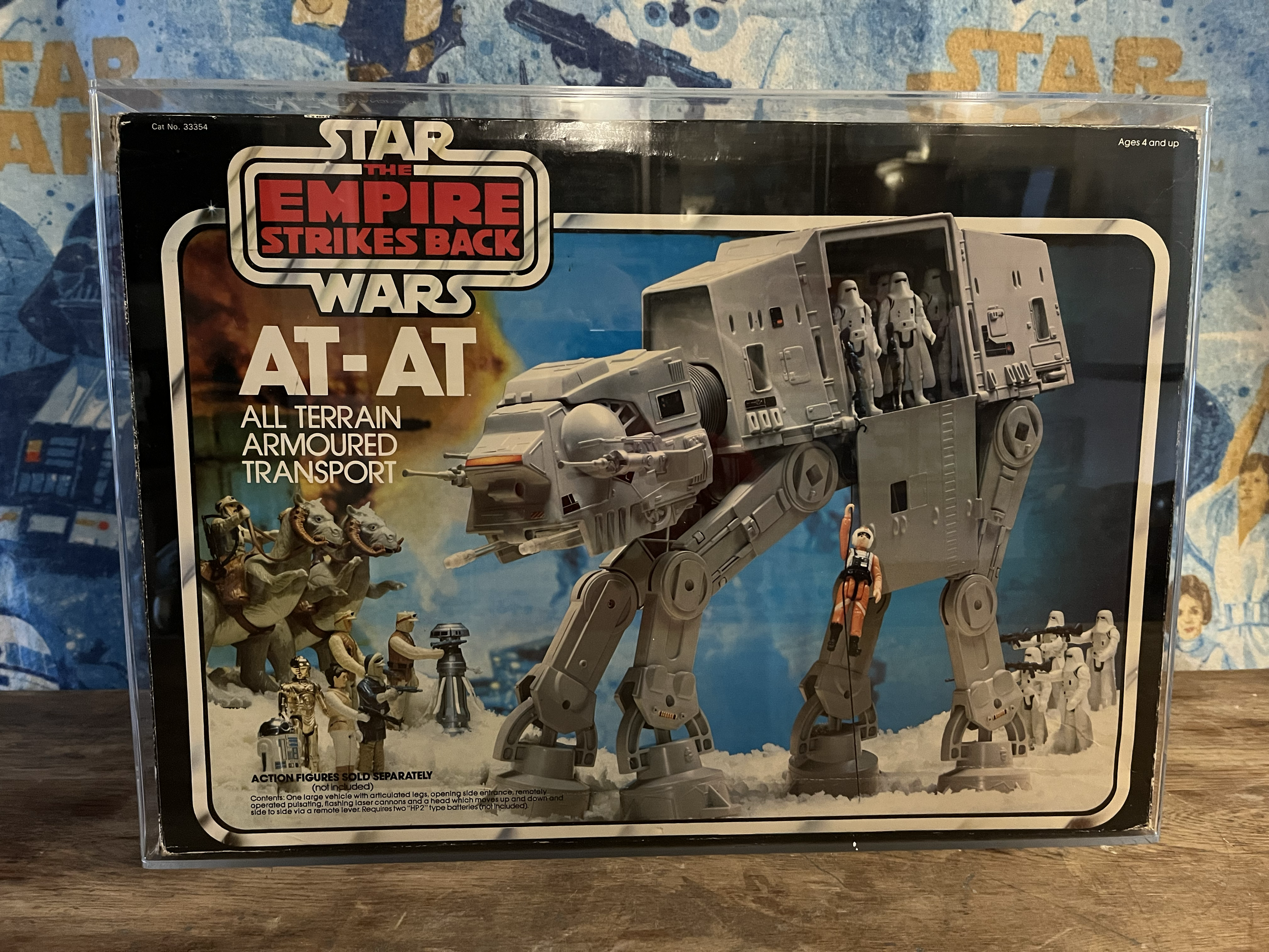 Box packaging of a Star Wars action figure set featuring the Empire Strikes Back All Terrain Armoured Transport (AT-AT) with model figures and miniature accessories displayed on the box.