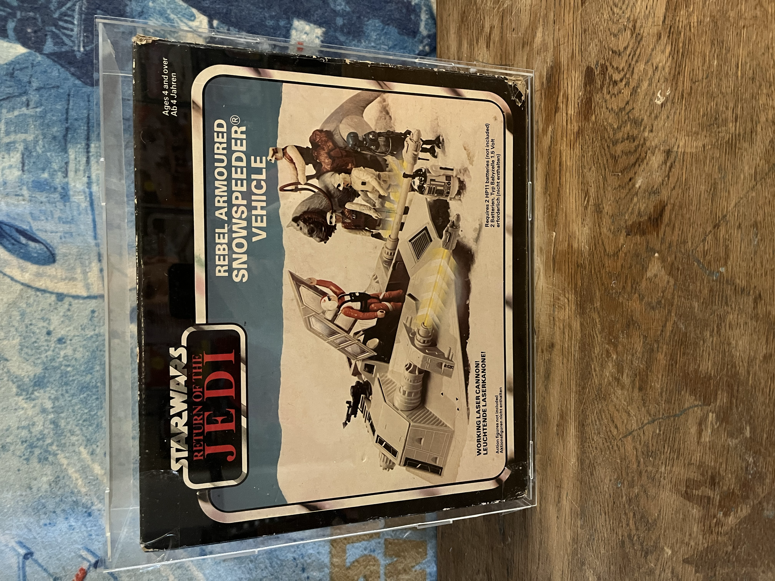 Star Wars Return of the Jedi action figure set, featuring characters in a desert landscape with a speeder bike, in original packaging.
