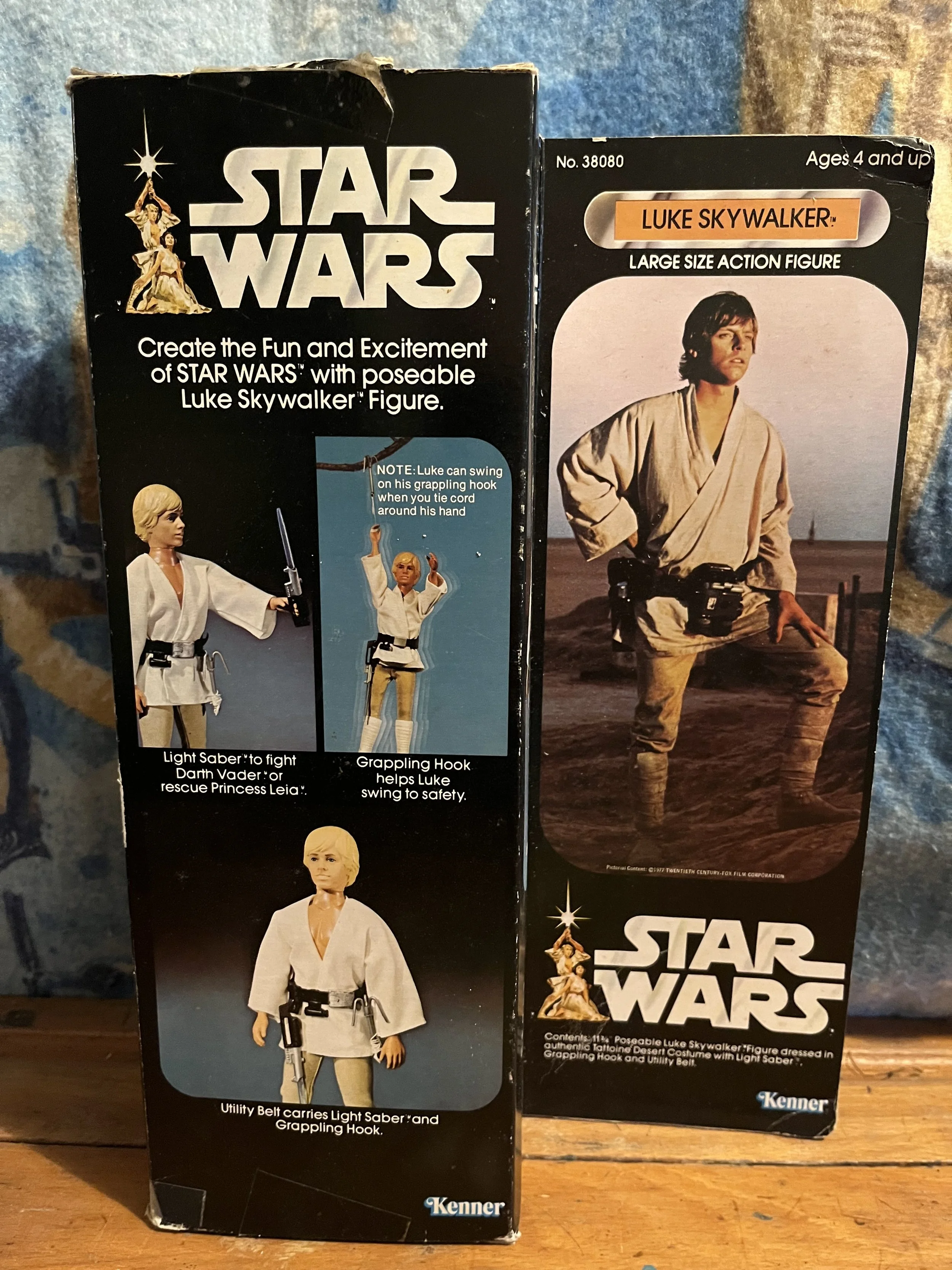 Kenner vintage Star Wars Luke Skywalker action figure packaging. The front of the box shows an image of Luke Skywalker dressed in a beige outfit, holding a lightsaber. It is a collectible, figure with a grappling hook and utility belt,