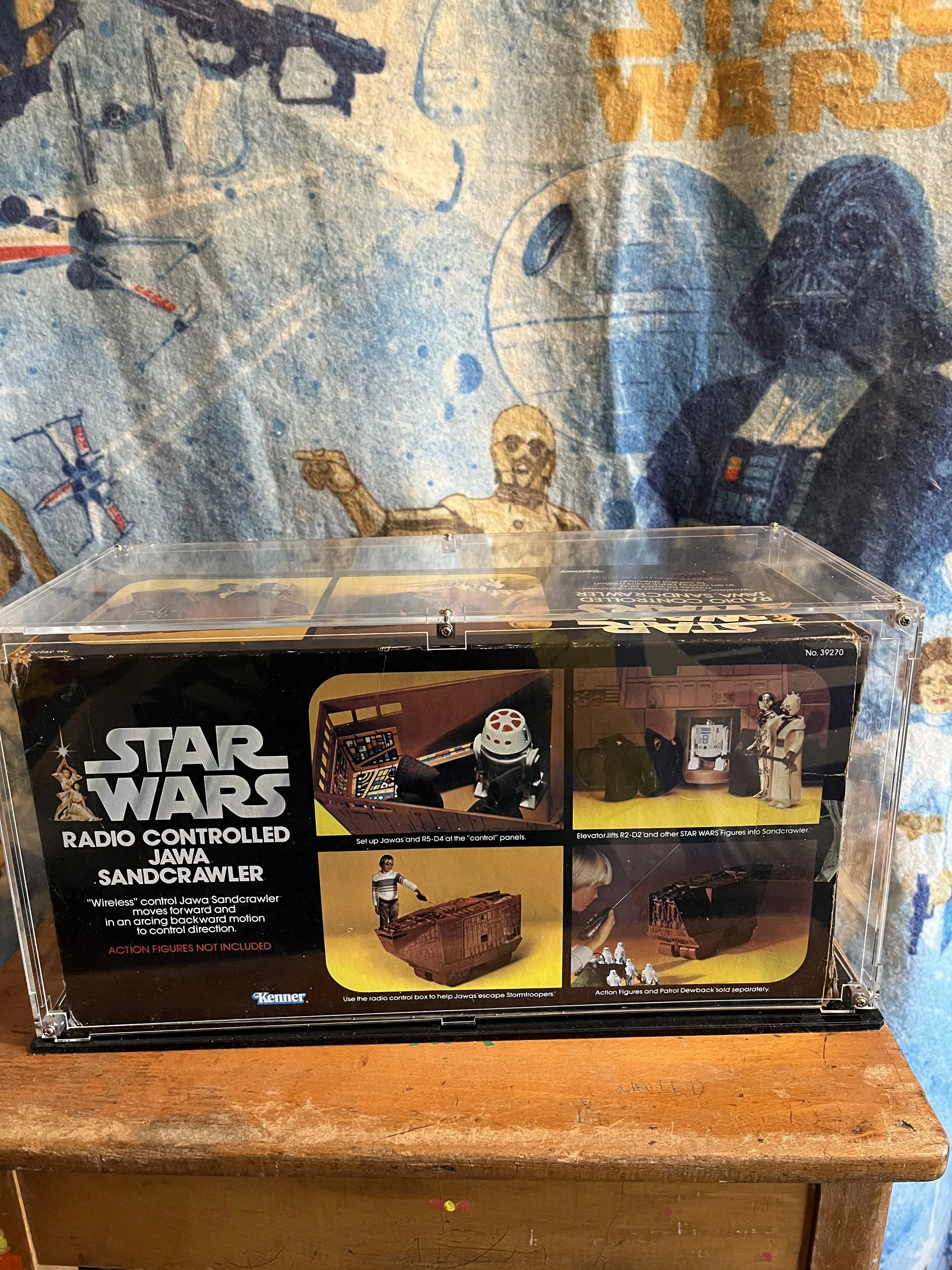 vintage Star Wars action figure toy box for the radio-controlled Jawa Sandcrawler. The packaging features images and descriptions of the toy's features such as remote control and the ability to lift R2-D2 and other figures into the Sandcrawler.
