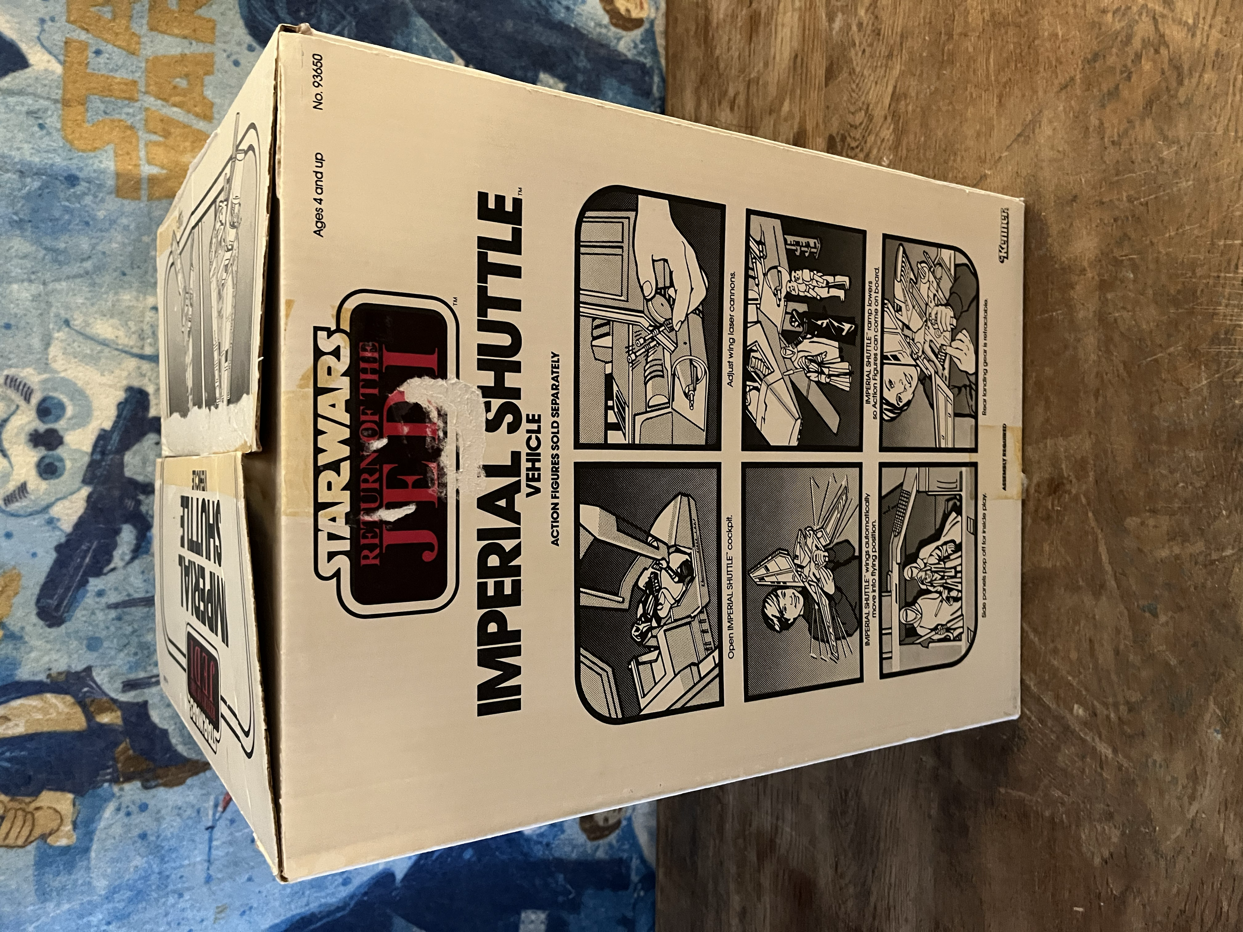 Box with instructions and illustrations for a Star Wars Imperial Shuttle toy, showing how to assemble and operate it.