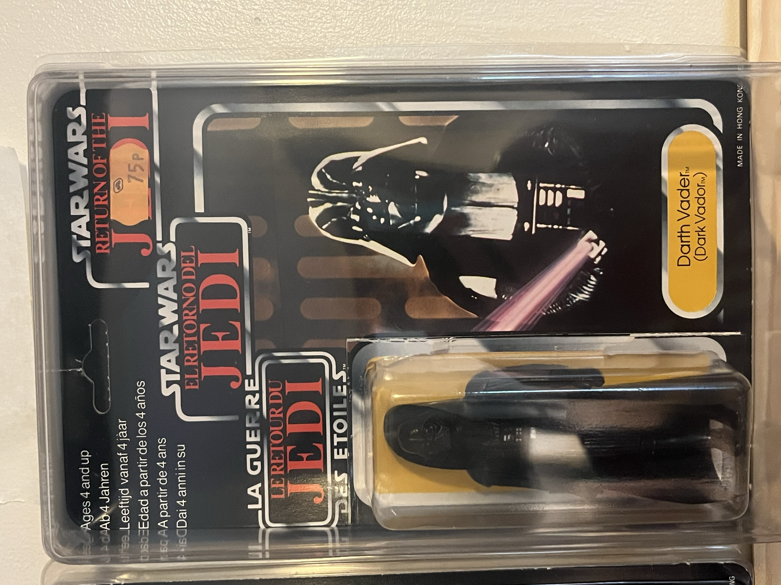 Star Wars action figure set in clear plastic packaging, featuring Darth Vader in black armor and helmet, with the label indicating 'Darth Vader (Dark Vador)' and the price of 75 pesos.