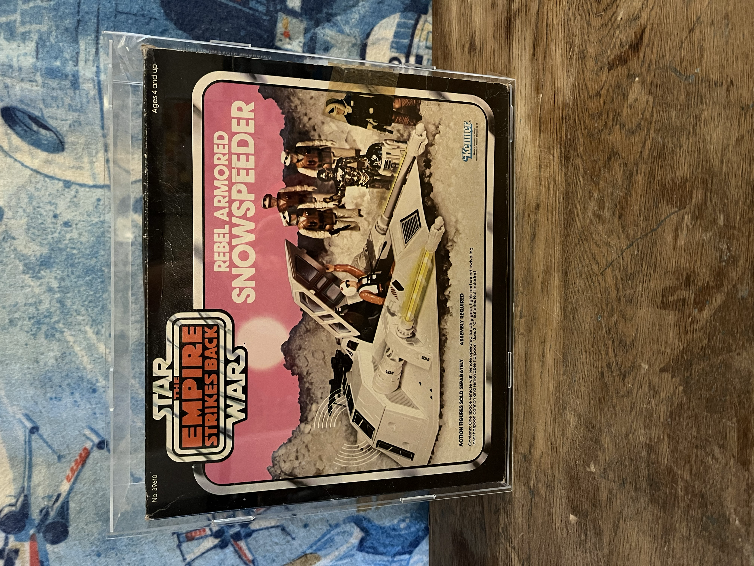 Box of the toy set 'Star Wars Empire Strikes Back Rebel Armored Snow Speeder' with artwork of snow speeders and characters in a snowy landscape.