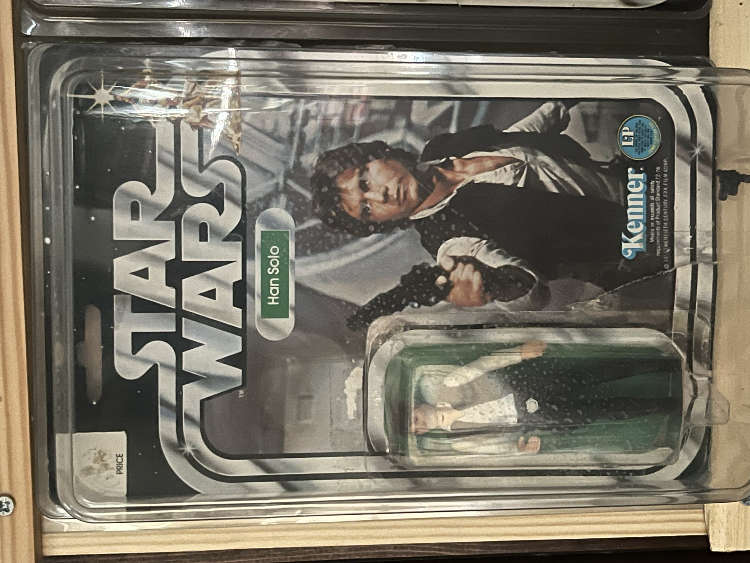 The image shows a vending machine featuring the Star Wars character Han Solo from the movie 'Solo.' The vending machine has a picture of Han Solo, a young man with brown hair, wearing a white shirt and a black vest. There is a blue and white circular