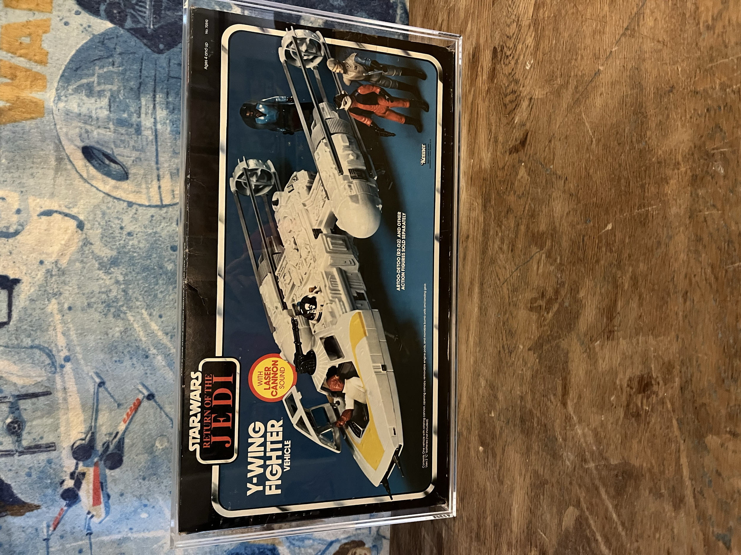 Packaging of a Star Wars action figure toy set depicting a scene from the Star Wars universe, featuring characters and vehicle accessories.