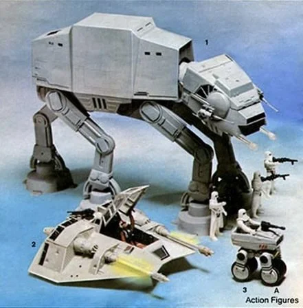 A large AT-AT walker toy walking on a blue surface with smaller spaceship and figures around it.