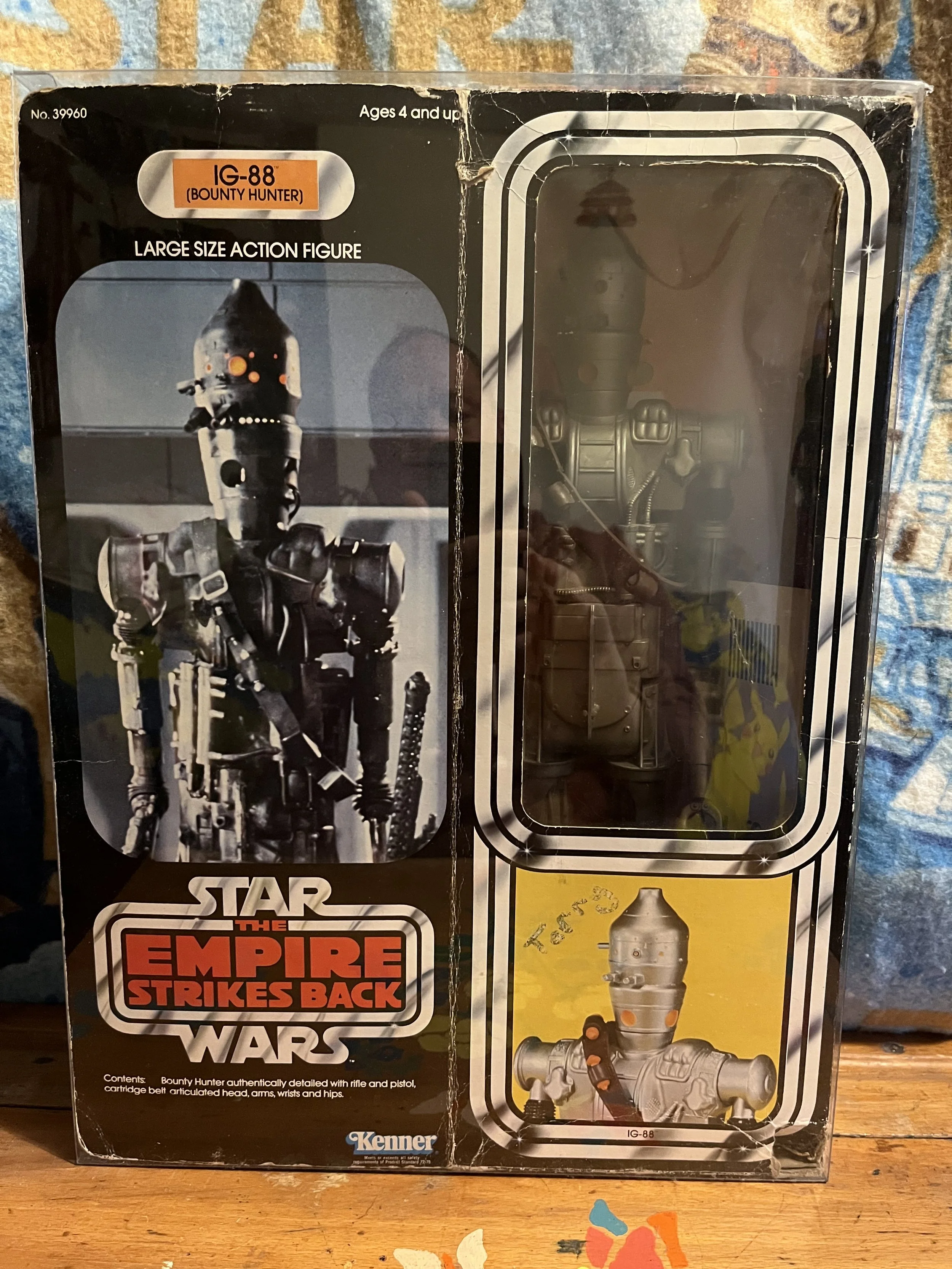 Star Wars The Empire Strikes Back Bounty Hunter IG-88 action figure in original box. Box cover shows IG-88 robot figure and includes a window displaying the figure inside.