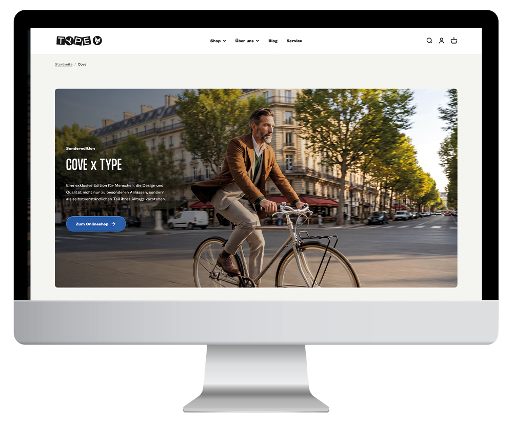Startseite eines Online-Shops mit einem Mann, der auf einem Fahrrad in einer Stadt fährt, im Hintergrund Bäume und Gebäude