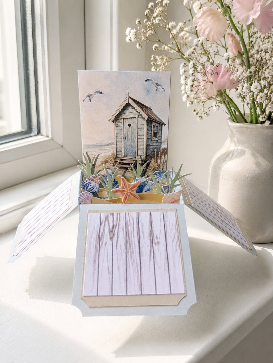 beach hut and sea view pop-up card