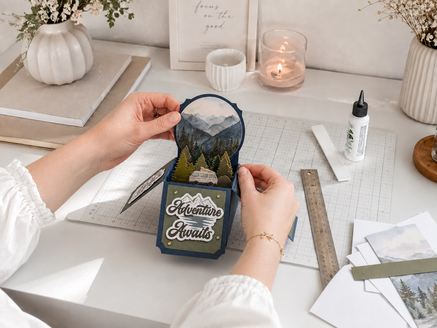 crafting an "adventure awaits" pop-up card