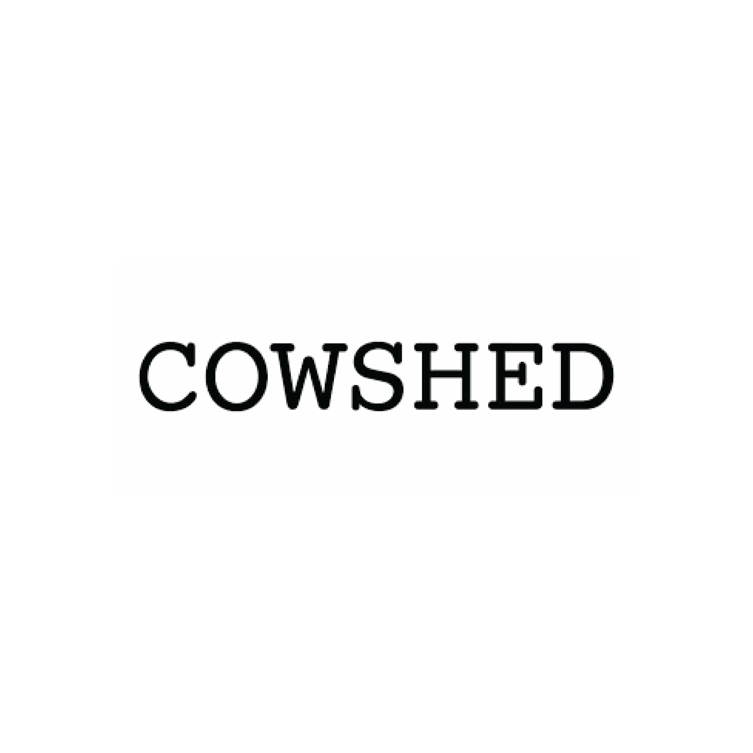 Close-up of a clothing label with the words 'COWSHED' printed on it.