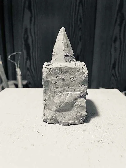 Pyramid on a block base, clay, 2022