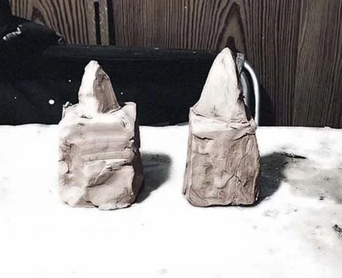 Two small, roughly shaped pyramid clay sculptures, 2023