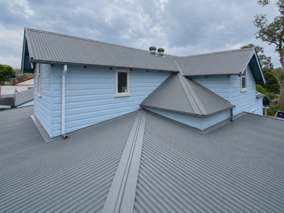 Oranssi technician working on a roof project