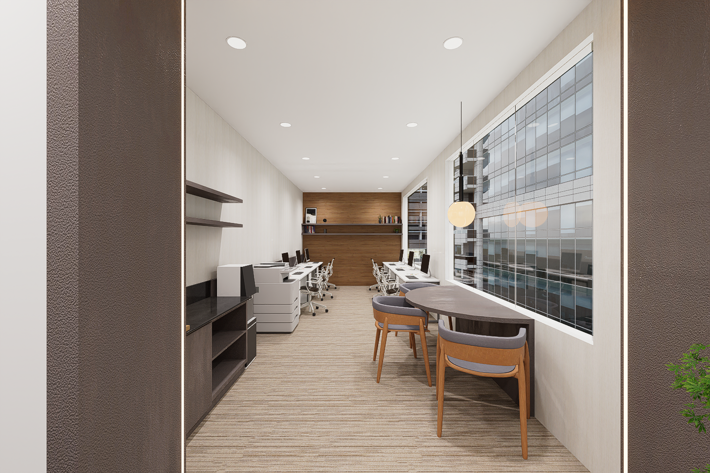 Office with workstations and seating area by large window with city view