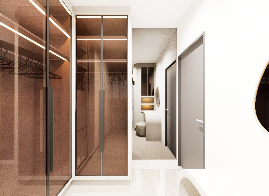 Modern walk-in closet with glass doors, built-in cabinets, and a reflection of a seating area with a mirror on a white wall.