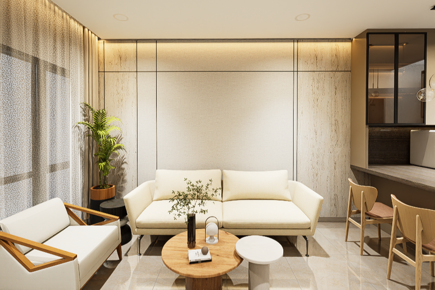 Modern living room with cream-colored sofa, armchair, wooden coffee table with decor, potted plant, and barstools along a kitchen counter.