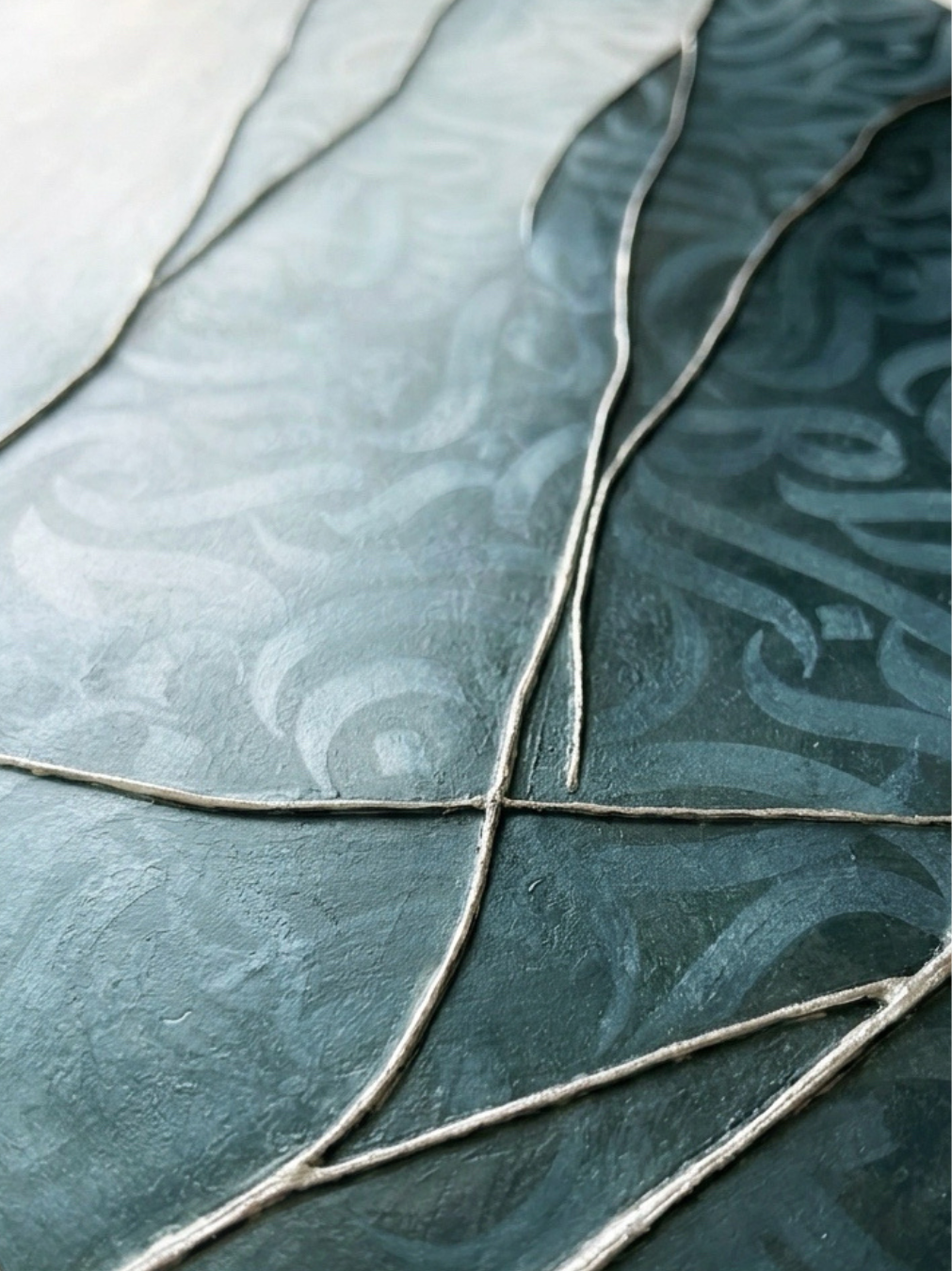 Close-up of an artwork, “Liminal Veil,” a mixed-media artwork by Shirin Roshanaie, featuring layered textures and Persian calligraphic forms. ShisArt Studio