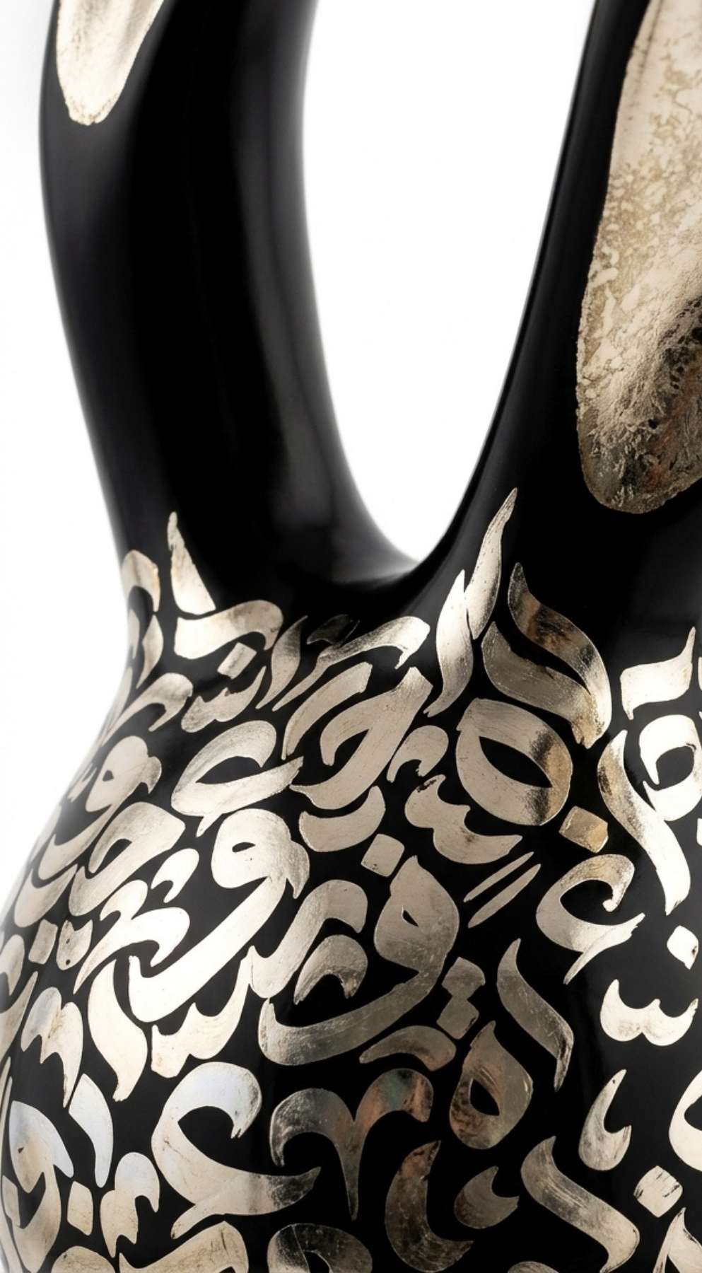 Close-up “Nouran,” an original mixed-media sculpture by Shirin Roshanaie, featuring a stylized rabbit form with Persian and Arabic calligraphic patterns in black and silver with metallic accents. ShisArt Studio