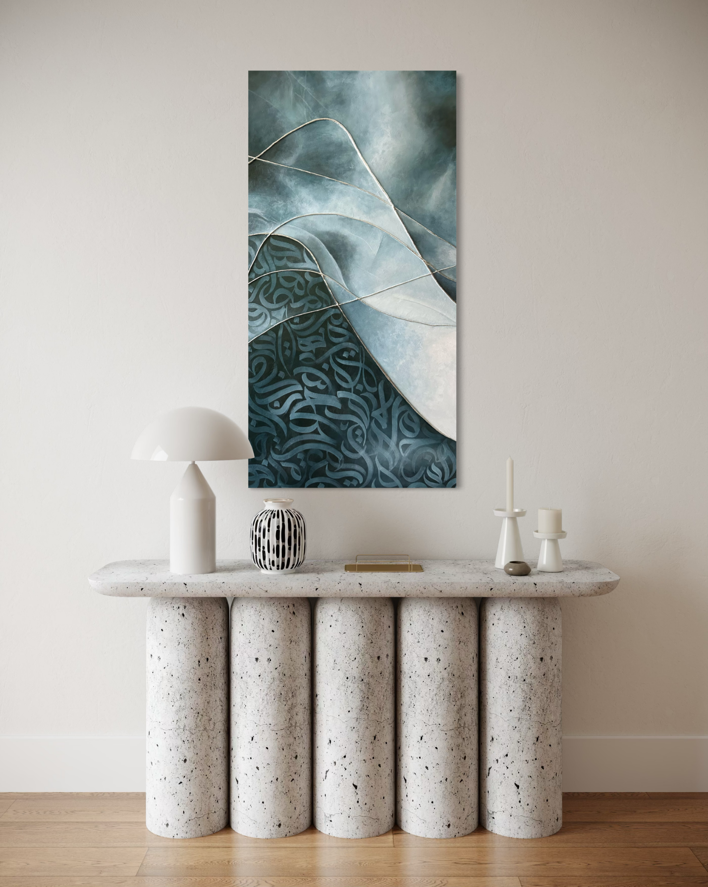 Original mixed-media artwork "Flux" by Shirin Roshanaie displayed in a modern minimalist interior, featuring layered blue-toned forms and flowing lines on a white wall. ShisArt Studio