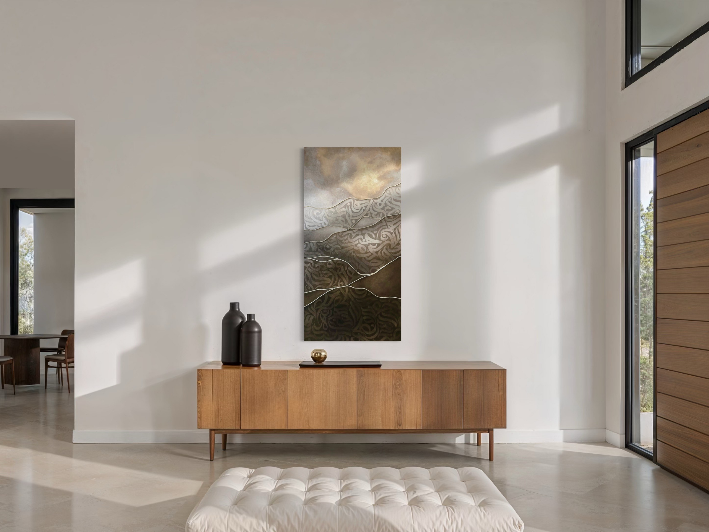 “Lightborne,” an original mixed-media artwork by Shirin Roshanaie, displayed above a wooden sideboard in a modern minimalist interior with natural light and neutral tones. ShisArt Studio