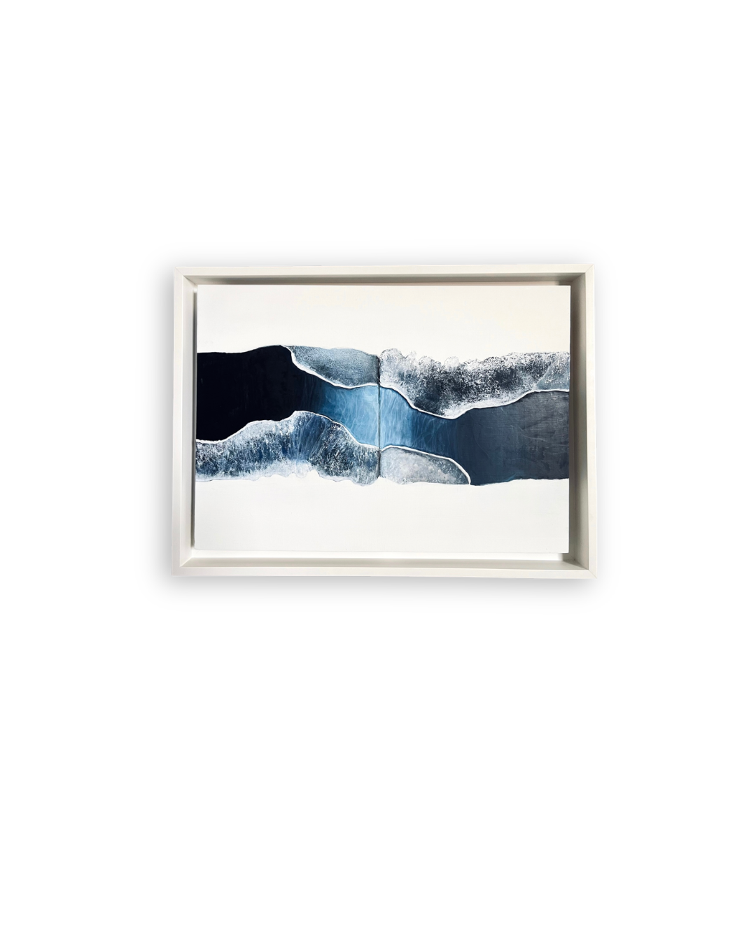 Abstract landscape artwork from the “Déjà Vu” collection by Shirin Roshanaie, featuring layered blue, black, and white forms inspired by water, in a white frame. ShisArt Studio