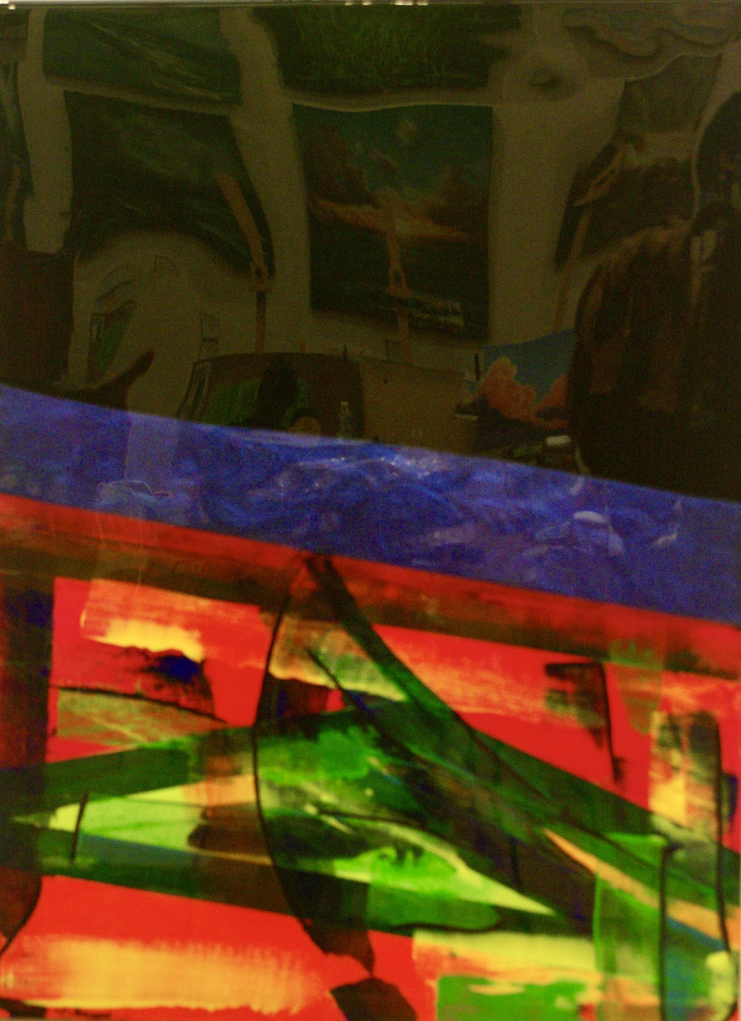 Colorful abstract painting with vibrant reds, greens, yellows, and blues, featuring bold brushstrokes and various geometric shapes.