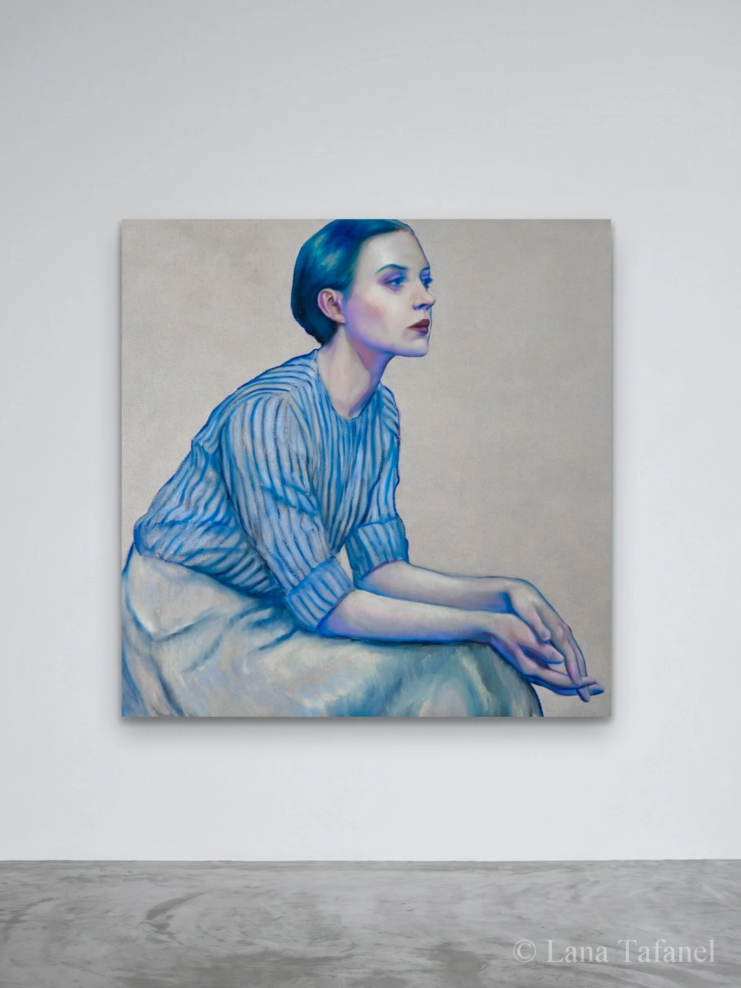 An oil painting of a woman with short blue hair, wearing a striped shirt, looking to the right, against a beige background. contemporary oil painting on a gallery wall