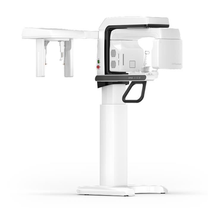 Medical imaging machine, likely an X-ray or CT scanner, with a white and black color scheme, mounted on a stand with a control panel.