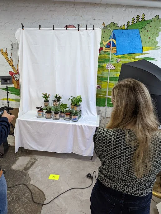 picture of collaboration with BaseCamp Printing. Professional photo being taken of our collab.