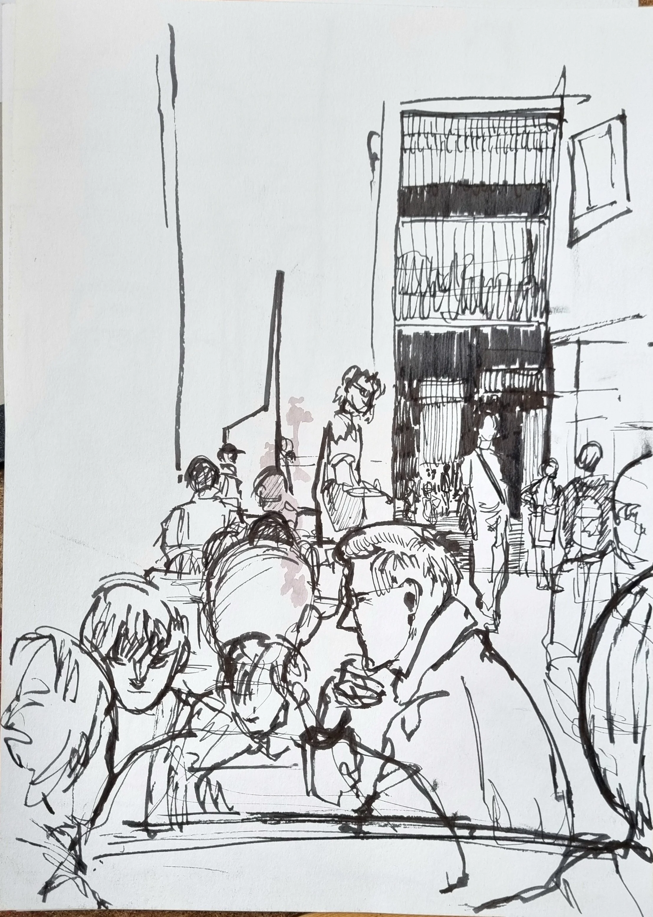 Black ink sketch of a busy city street scene with people walking, a tall building with a grid-like facade, and a window on the right side.
