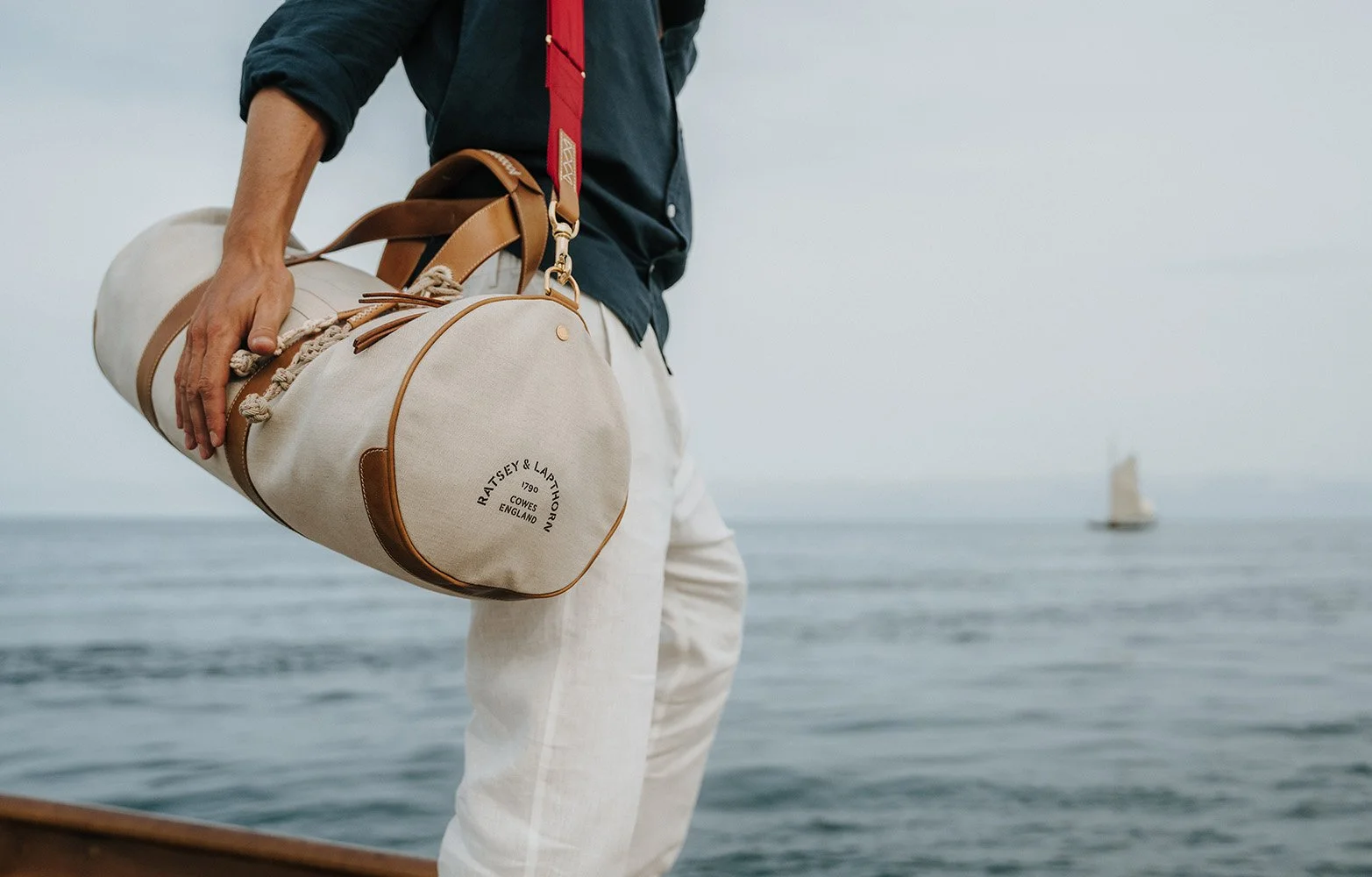 Ratsey & Lapthorn cream Ratpack bag held by model