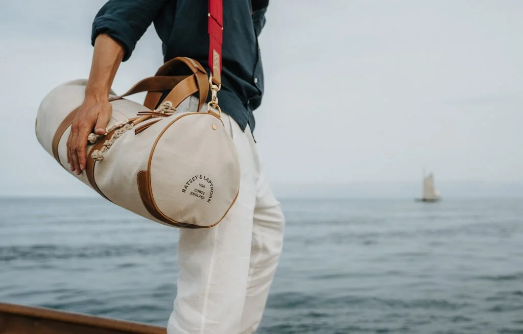 Ratsey & Lapthorn cream Ratpack bag displayed by model