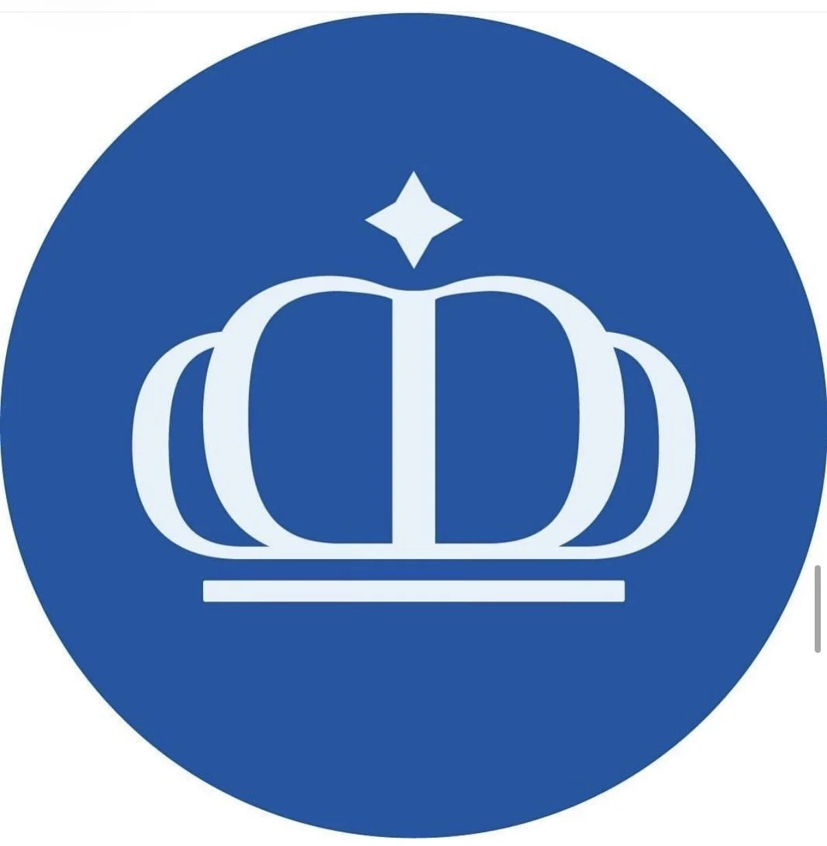 A blue circular sign with a white crown and a star above it.