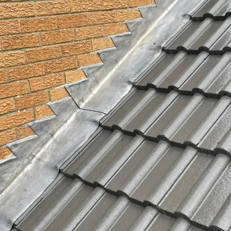 Lead flashing dressed around a chimney by Gosforth Roofing
