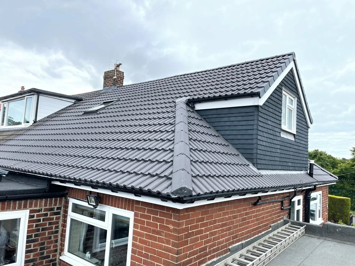 Roofers carrying out a full re-roof on a property in Newcastle upon Tyne